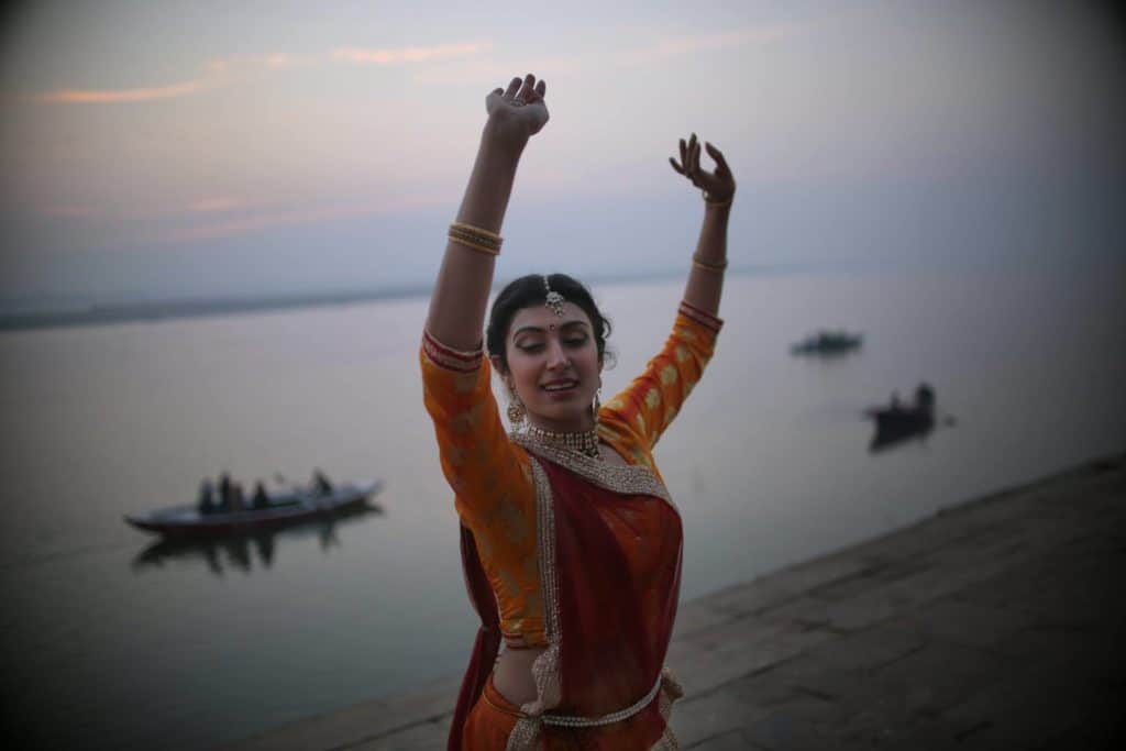Shinjini Kulkarni practices Kathak dancing on the banks of the Ganges in Varanasi at dawn, Photo courtesy of Souvid Datta.